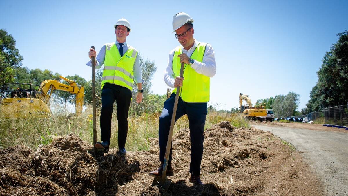 ACT Transport Minister Chris Steel with ACT Senator Zed Seselja turning a sod on Tuesday to mark the start of upgrades on the Monaro Highway. Picture: Elesa Kurtz