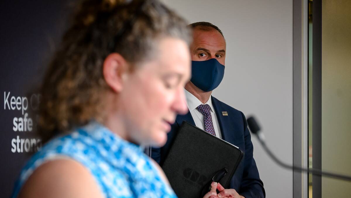 Chief Minister Andrew Barr watches as chief health officer Dr Kerryn Coleman addresses the media on Canberra's first full day of lockdown, August 13. Picture: Elesa Kurtz