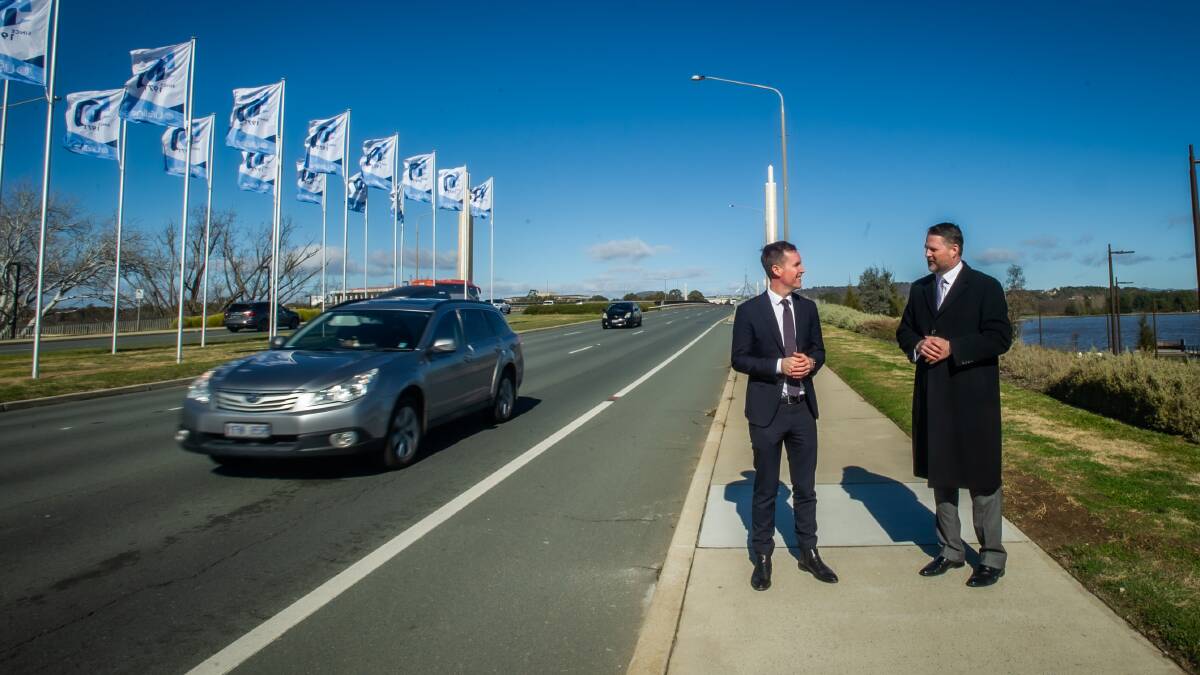 Transport Minister Chris Steel with the ACT's chief projects officer Duncan Edghill beside Commonwealth Avenue on Wednesday. Picture: Karleen Minney
