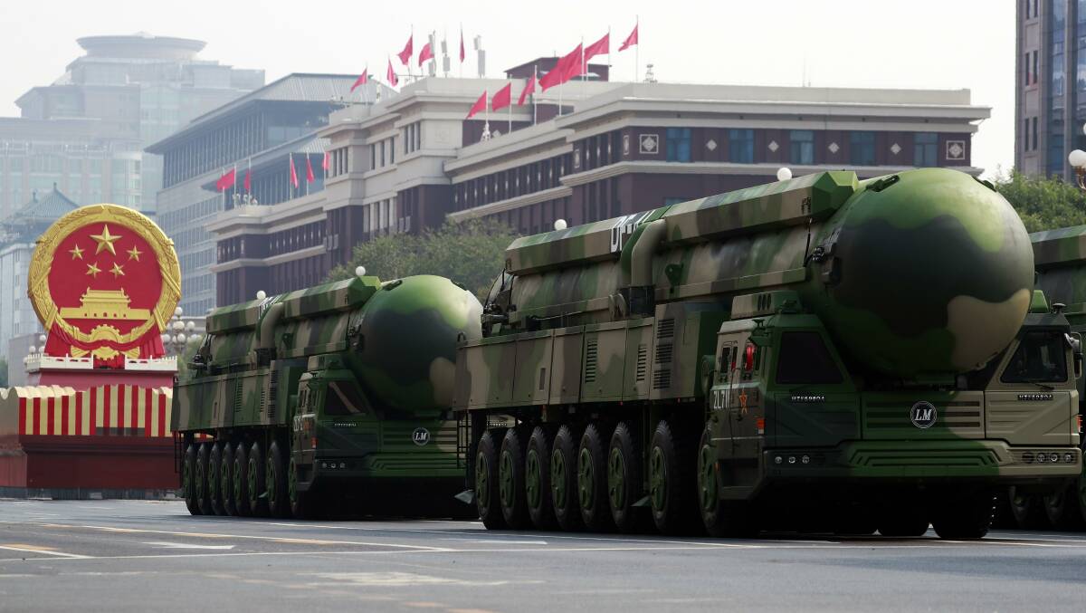 Military vehicles carrying nuclear-capable DF-41 intercontinental ballistic missiles during a military parade marking the 70th anniversary of the founding of the People's Republic of China in October. Picture: Getty Images