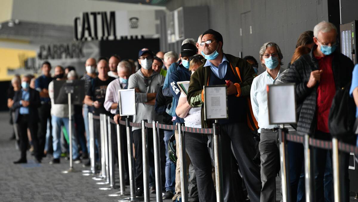 Victorians queue at a mass vaccination centre. Picture: Getty Images