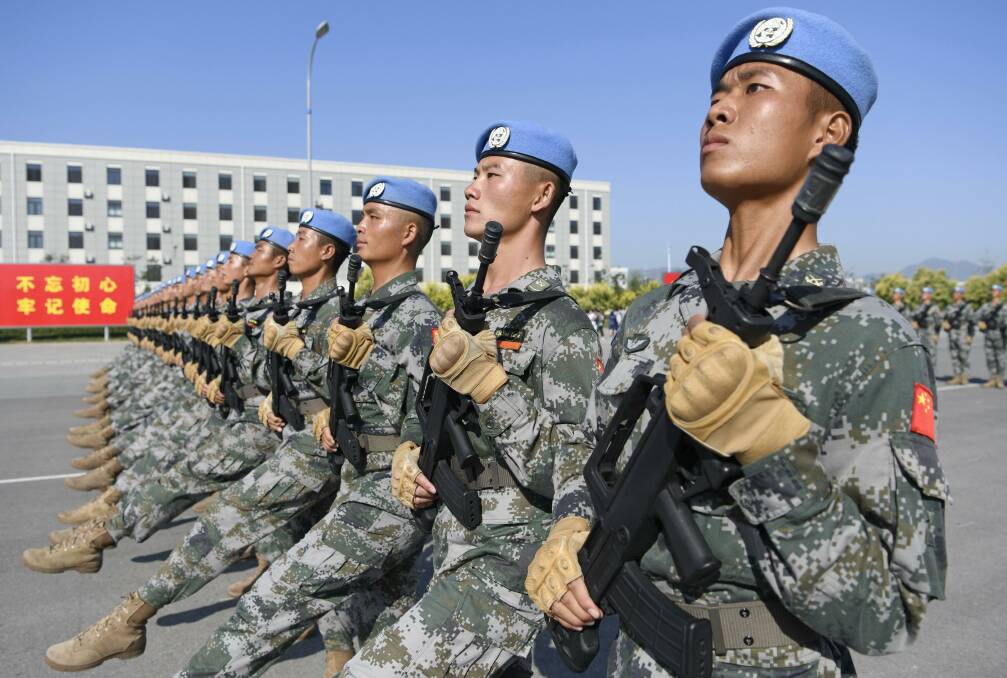 Chinese soldiers practice in Beijing in September ahead of a military parade. Picture: Getty Images