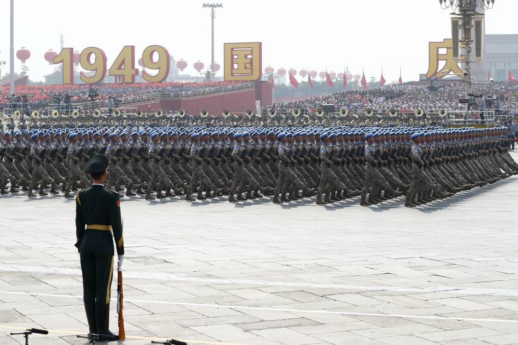 A formation of Chinese peacekeepers marches during a parade to celebrate the 70th anniversary of the founding of the People's Republic of China in October. Picture: Getty Images
