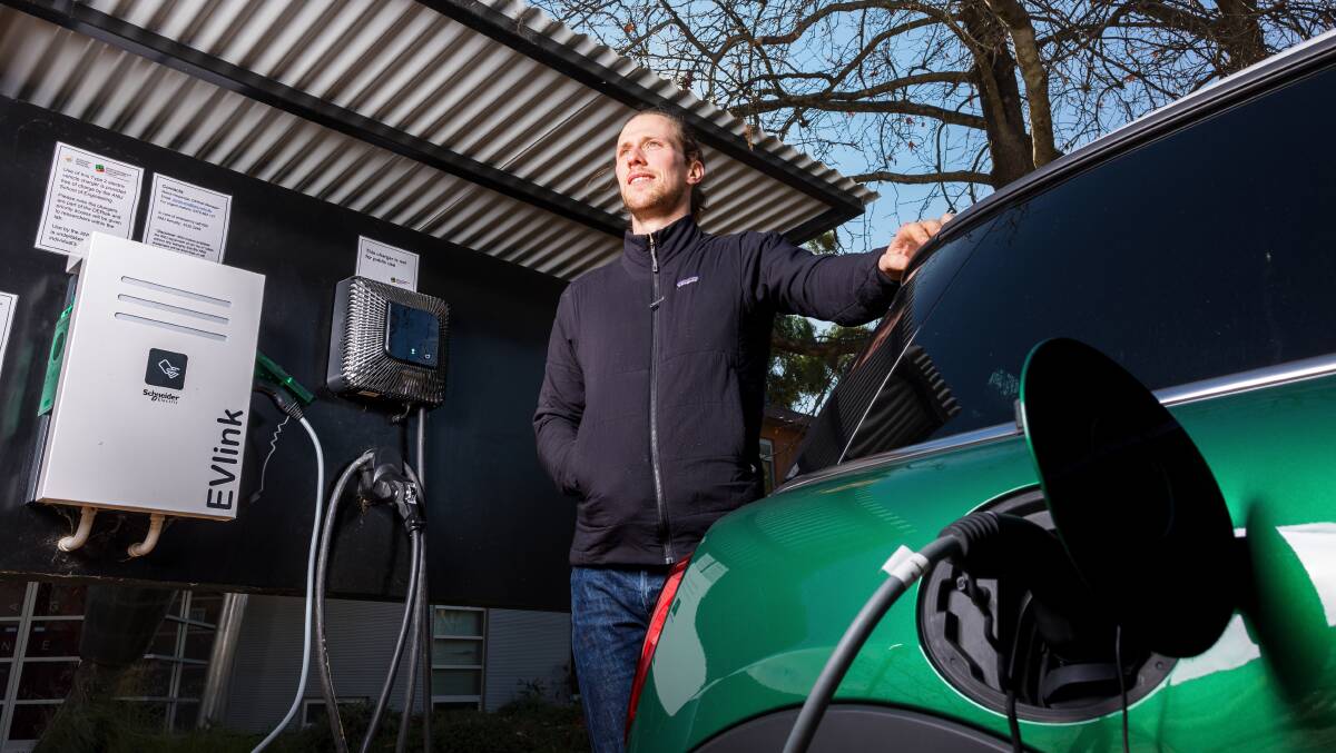 Researcher Dr Bjorn Sturmberg at an EV charging station at the ANU. Picture: Sitthixay Ditthavong
