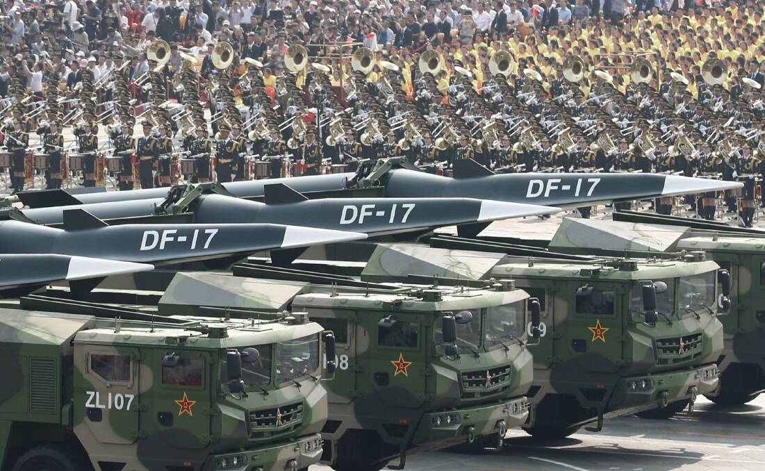 Military vehicles carrying DF-17 ballistic missiles march during a parade to celebrate the 70th anniversary of the founding of the People's Republic of China at Tiananmen Square in October. Picture: Getty Images
