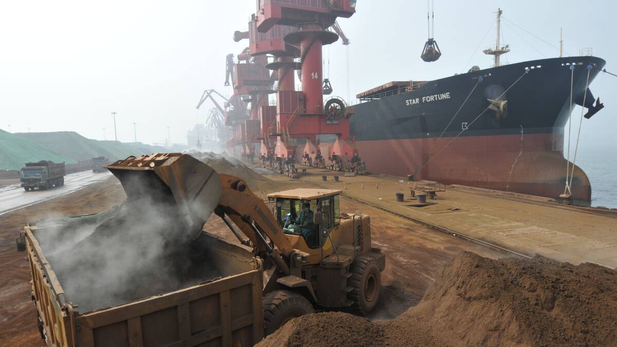 Iron ore from Australia is unloaded at Rizhao Port, one of China's biggest ports for importing the commodity. Picture: Getty Images