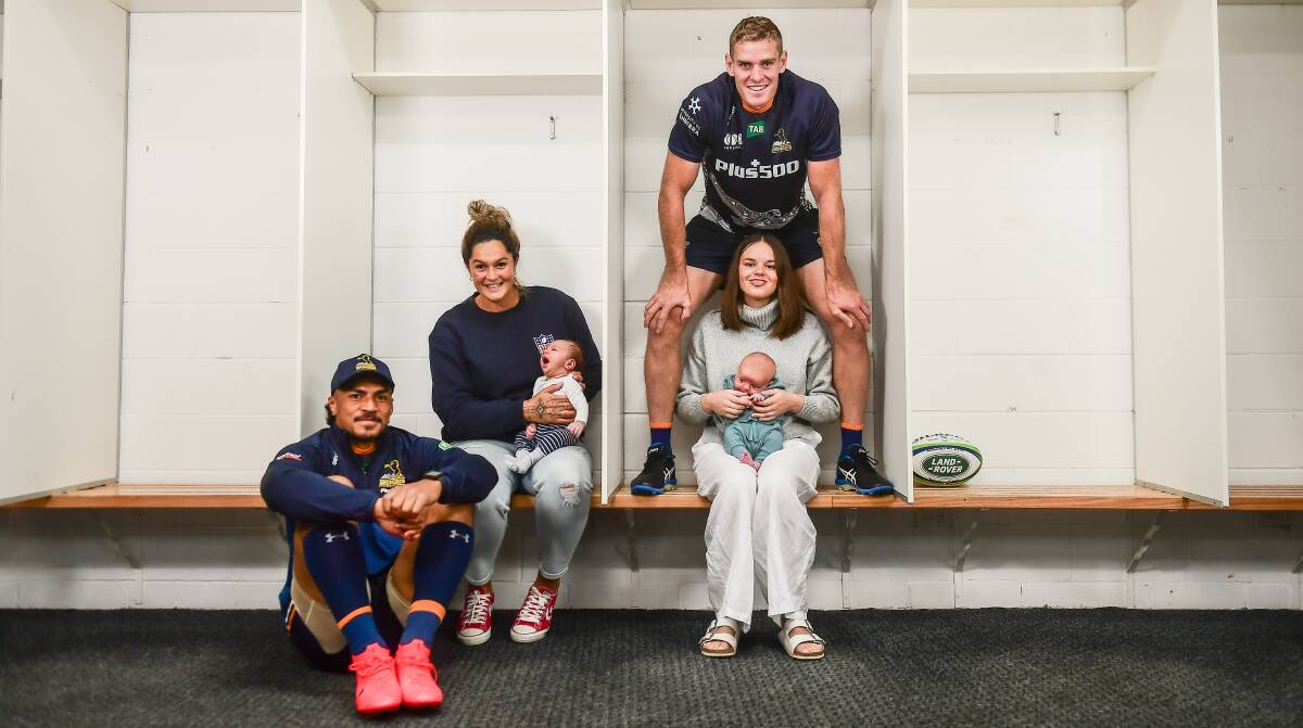 Brumby Pete Samu with partner Rebecca Van Kuyk and son Grayson and Tom Cusack, wife Amy Cusack and daughter Rosie. Picture: Karleen Minney.