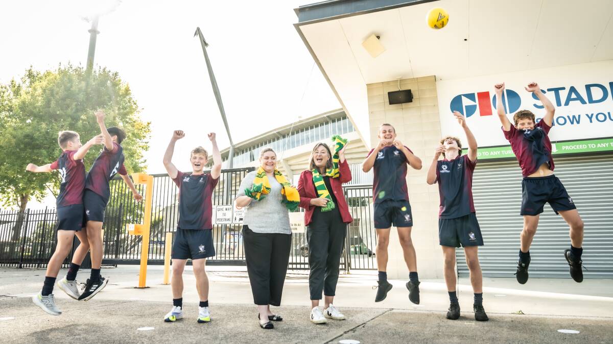 Capital Football chief Samantha Farrow and ACT Sport Minister Yvette Berry with young soccer fans ahead of the Socceroos' return. Picture by Karleen Minney