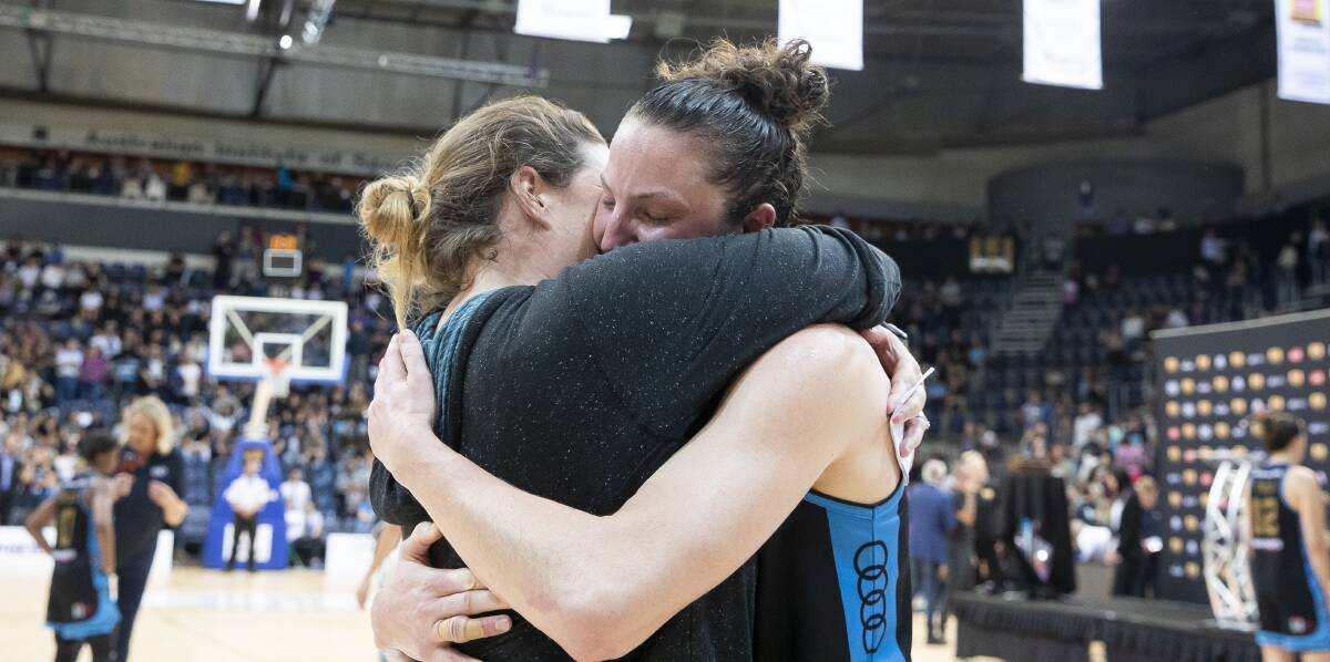 Kelsey Griffin embraces her wife Erin after clinching another championship. Picture: Sitthixay Ditthavong