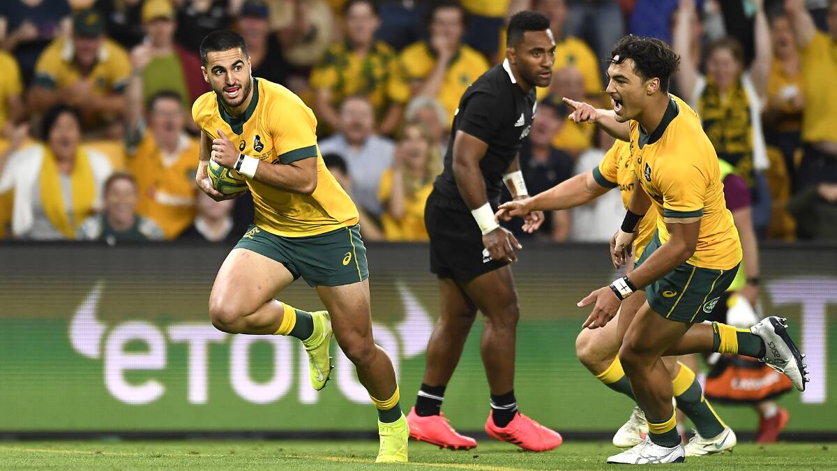 Wallabies winger Tom Wright scored a try with his first touch in Test football. Picture: Getty