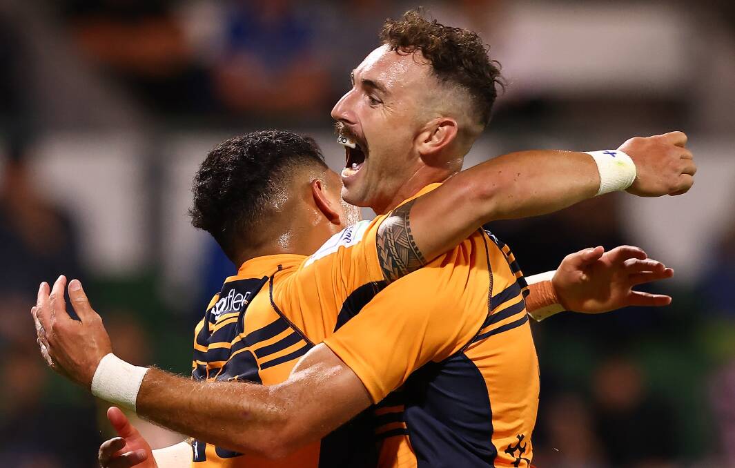 Nic White and Noah Lolesio celebrate an early try in the Brumbies' season-opening win. Picture: Getty