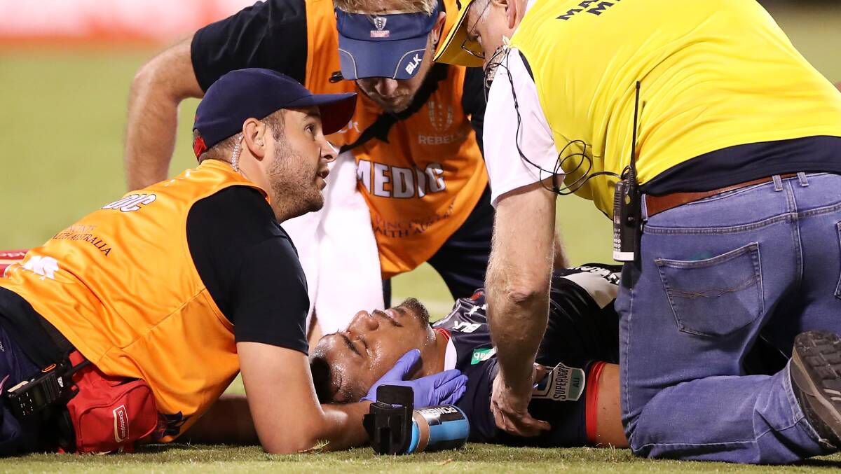 Pone Fa'amausili being attended to after copping a heavy knock from Allan Alaalatoa. Picture: Getty