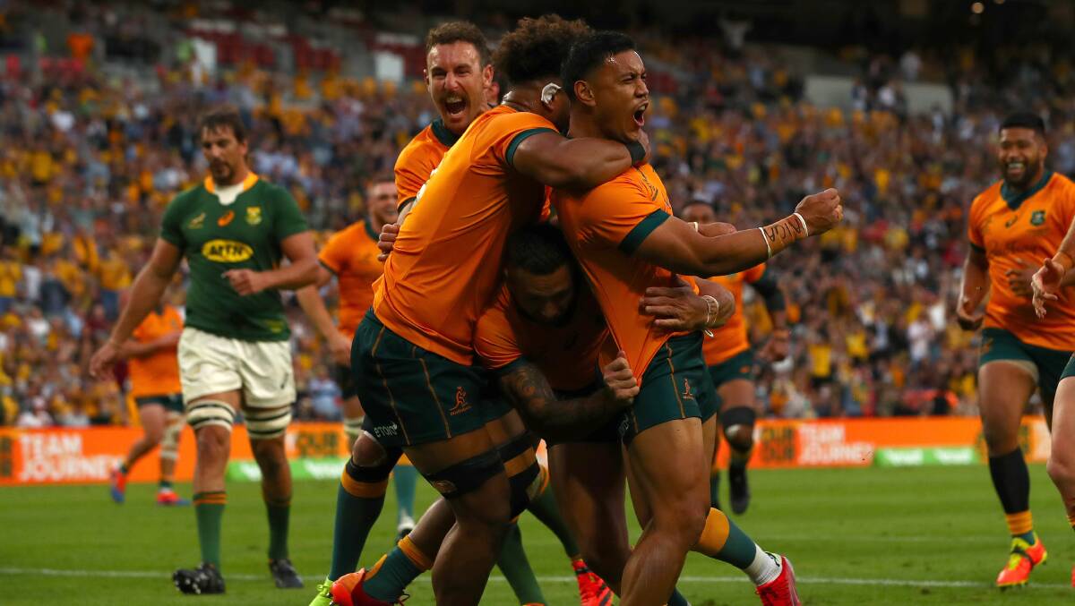 Wallabies outside centre Len Ikitau scored two tries in the space of seven minutes to set up a win over the Springboks. Picture: Getty