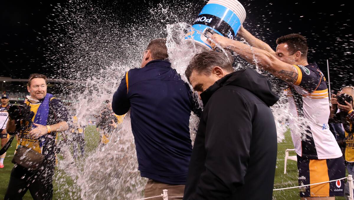 Dan McKellar was drenched in celebrations. Picture: Getty
