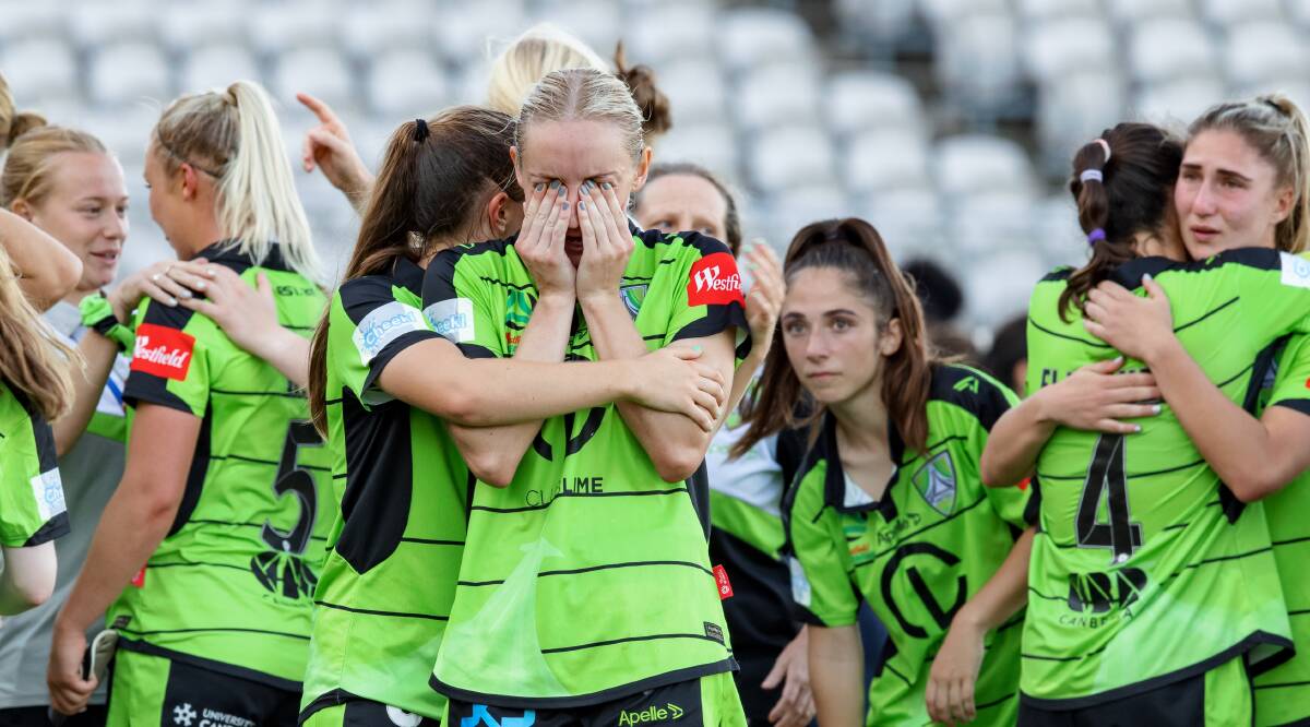 Laura Hughes consoles Nicki Flannery in the wake of Canberra's heartbreaking loss to Sydney FC. Picture: Sitthixay Ditthavong