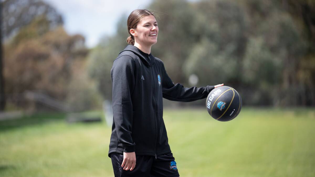 Jade Melbourne is at ease with a basketball but she tried her hand at everything during the women's summer of sport launch. Picture by Sitthixay Ditthavong