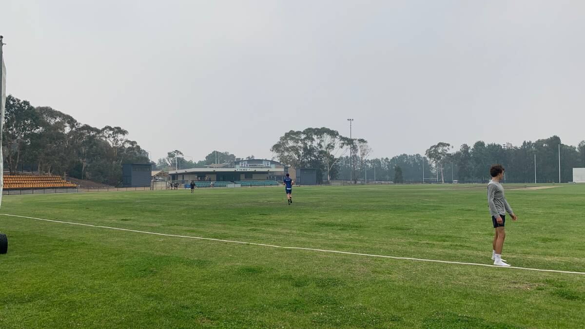 Play was delayed at stages at Kippax Oval due to the smoke haze. Picture: Supplied