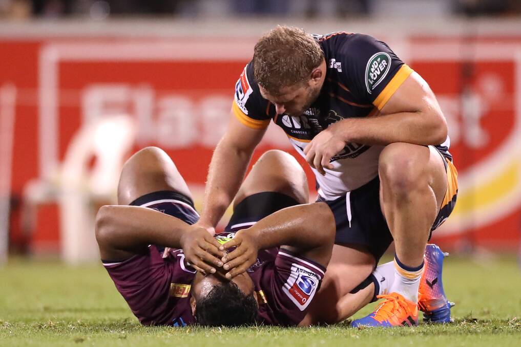 James Slipper consoles Reds counterpart Taniela Tupou after the final whistle. Picture: Getty