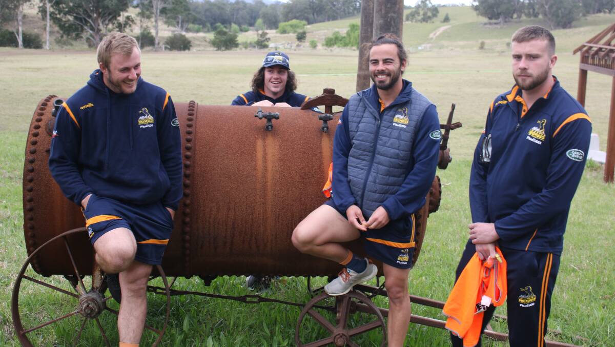 Will Miller, Lachlan Lonergan, Andy Muirhead and Mack Hansen helped rebuild fences in fire-affected communities on Wednesday. Picture: Brumbies Media