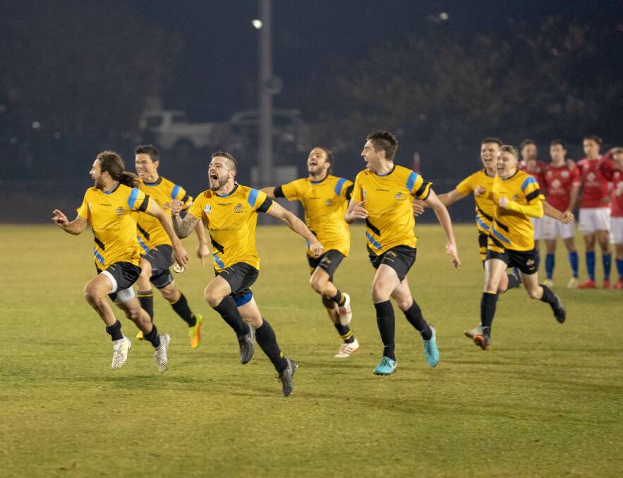 Cooma Tigers players celebrate their shootout win. Picture: David Jordan (Capital Football)