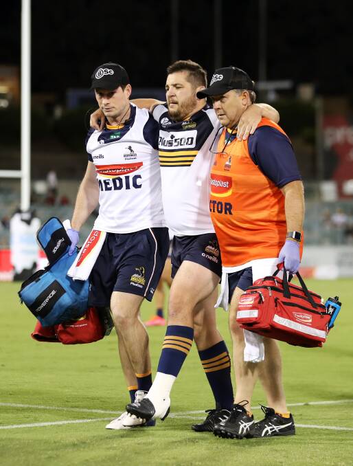 Connal McInerney was helped from the field on Saturday night. Picture: Getty