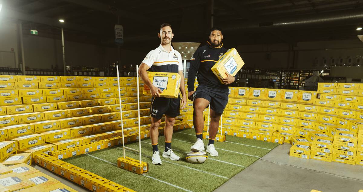 Nic White and Folau Fainga'a on hand to unveil a commemorative can. Picture: Dion Georgopoulos