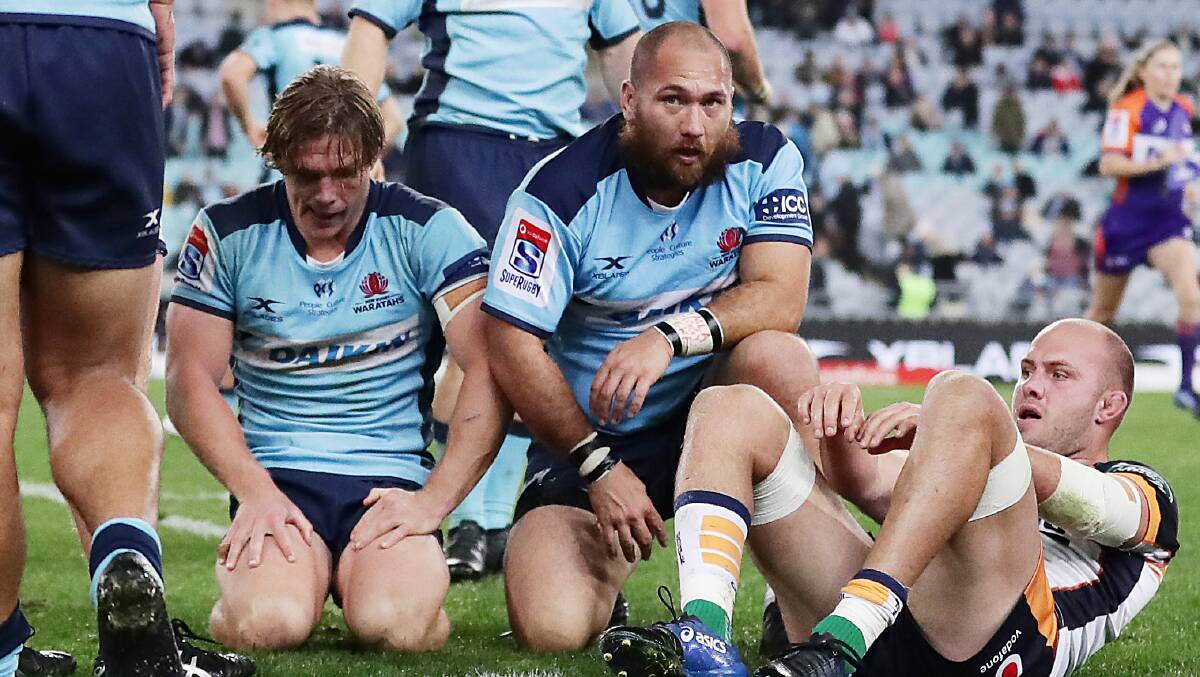 The Waratahs were left dejected after letting one slip. Picture: Getty