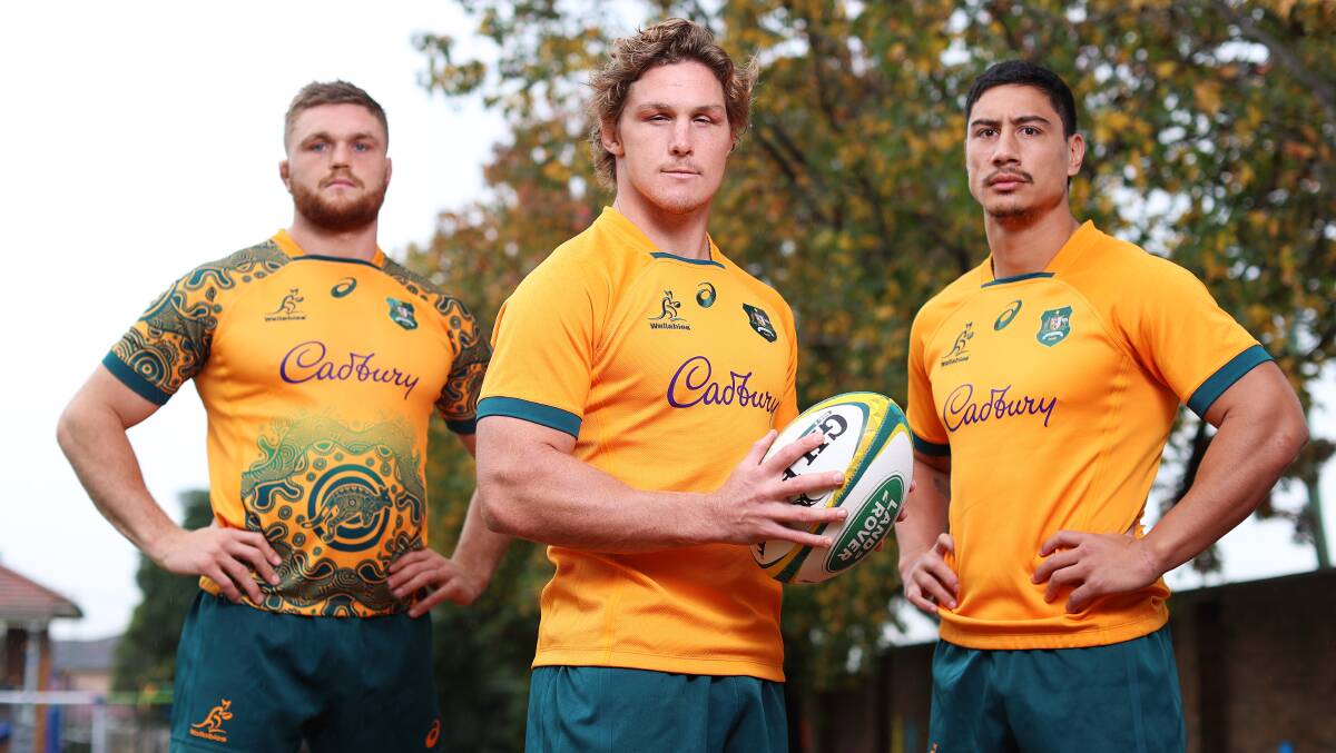 Lachlan Swinton, Michael Hooper and Izaia Perse unveil the new Wallabies jerseys. Picture: Getty