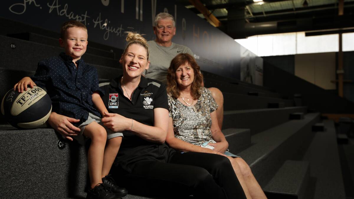 Lauren Jackson with her son Harry, and mum and dad, Maree and Gary. Picture: James Wiltshire