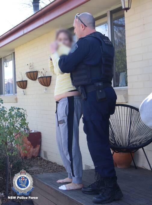 Another woman is arrested in Queanbeyan during raids on Thursday. Picture: NSW Police