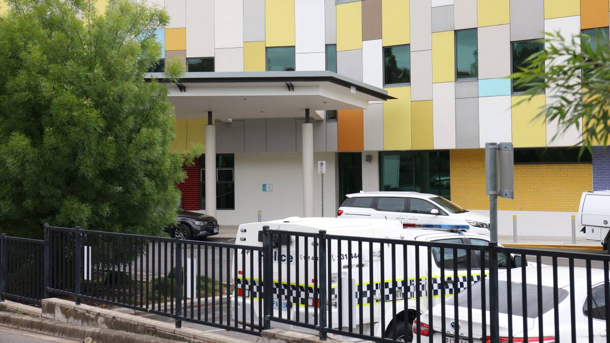 A police van parked outside the adult mental health unit at Canberra Hospital after the alleged murder. Picture by James Croucher