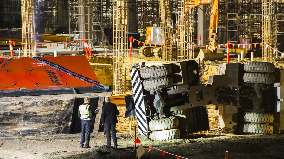 The fallen crane rests on its side at the University of Canberra Hospital construction site in August 2016. Picture: Rohan Thomson