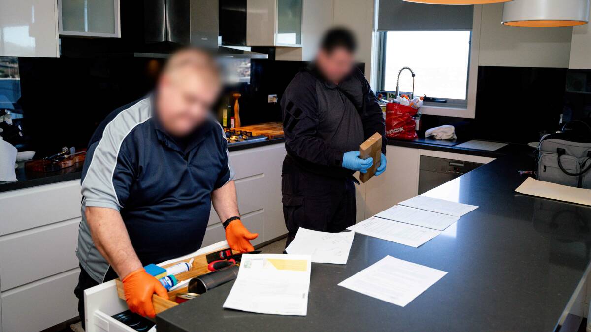 Police execute a search warrant on Thursday as part of their investigation. Picture: ACT Policing
