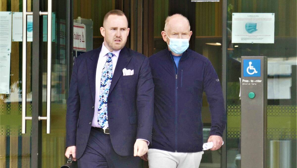 Stephen Mitchell, right, leaves court with lawyer Peter Woodhouse after being granted bail in February. Picture: Toby Vue