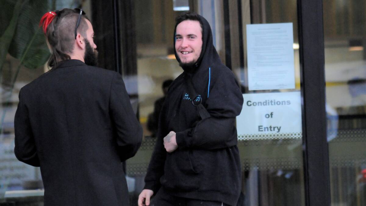 Jordan Crooke smiles at reporters as he leaves court on Thursday. Picture: Blake Foden