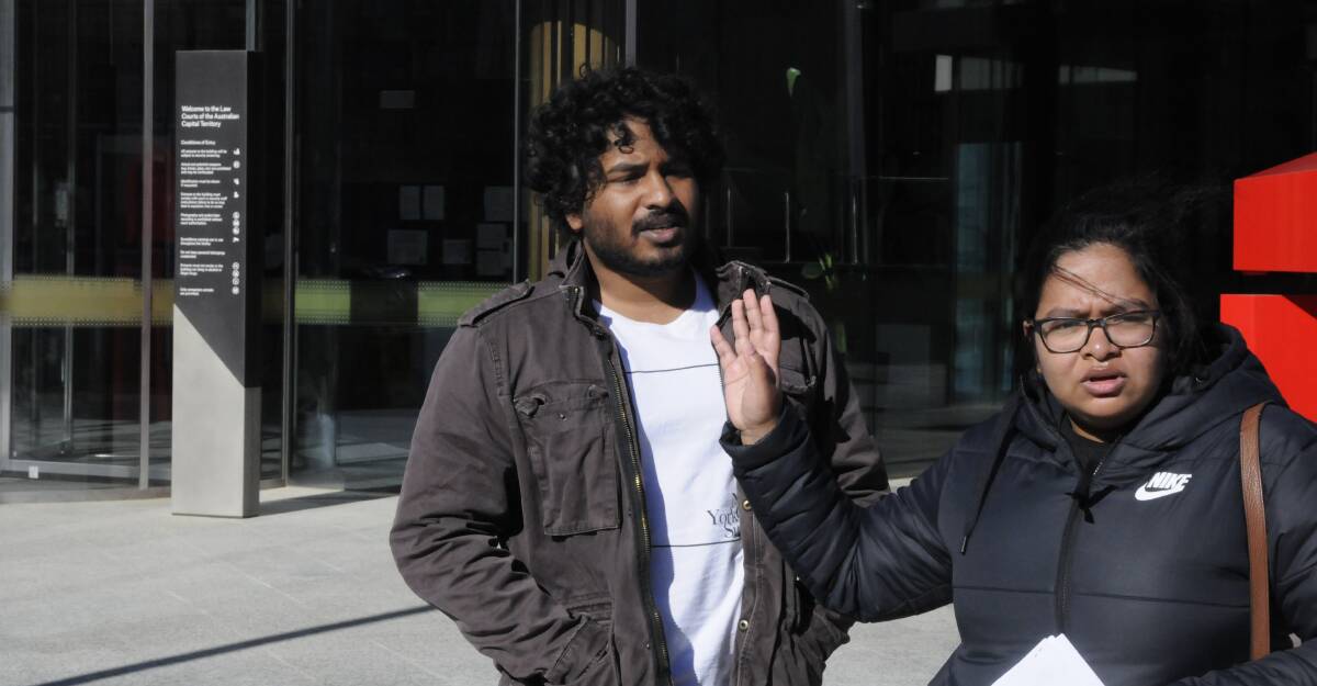 Chavin Seneviratne leaves the ACT Magistrates Court as an angry supporter confronts a reporter. Picture: Blake Foden