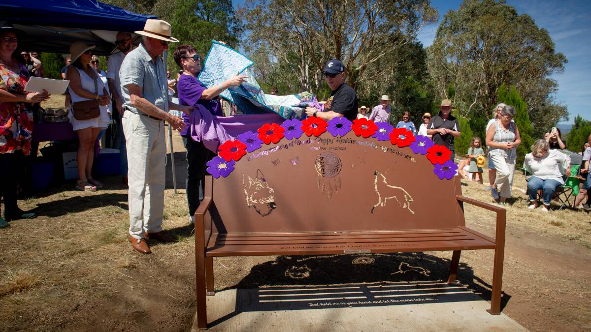 Janine Haskins unveils daughter Bronte's memorial bench with husband Peter McLaren, right, and Member for Ginninderra Peter Cain, left. Picture by Elesa Kurtz
