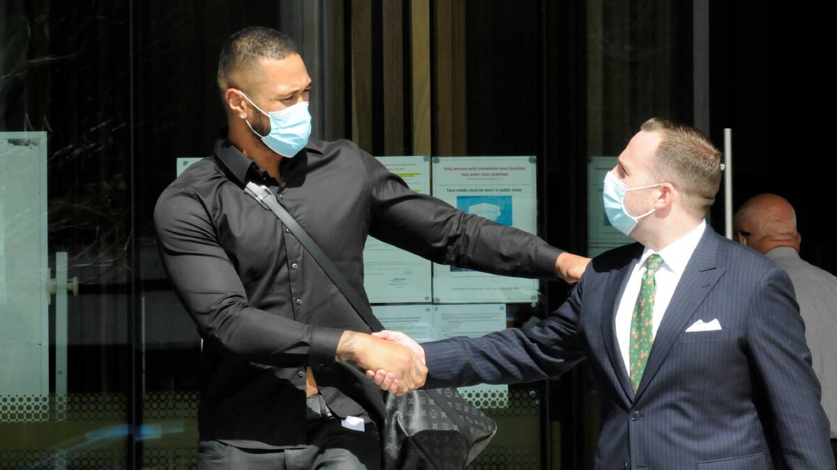 Paea Talakai bids lawyer Peter Woodhouse farewell outside court on Monday. Picture: Blake Foden