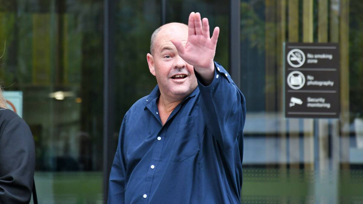 John Nocen waves to a reporter after being released. Picture by Hannah Neale