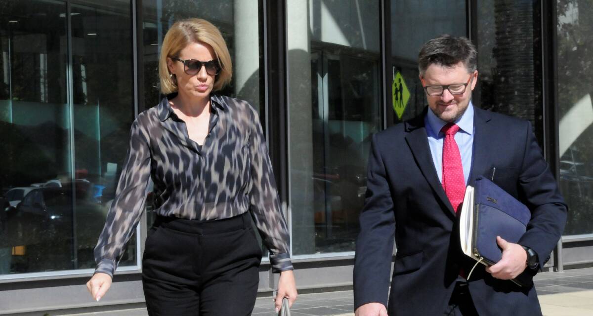 Emma Morton, left, leaves court with lawyer Gavin Mansfield on Friday morning. Picture: Blake Foden
