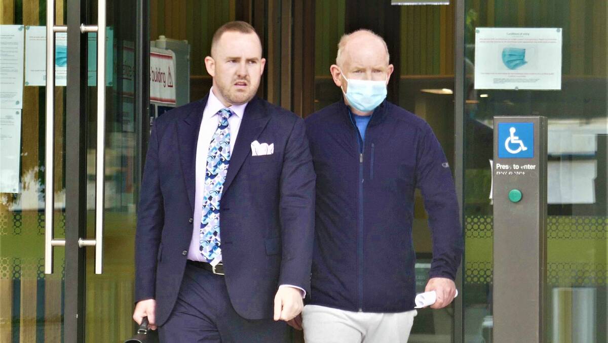 Stephen Mtichell, right, outside court with defence lawyer Peter Woodhouse after his first appearance in February. Picture by Toby Vue