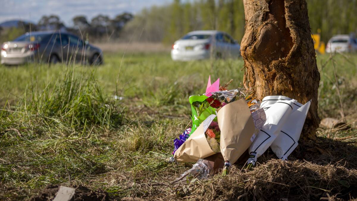 Flowers left at the scene on the Monaro Highway after the two girls were killed on October 9. Picture by Sitthixay Ditthavong