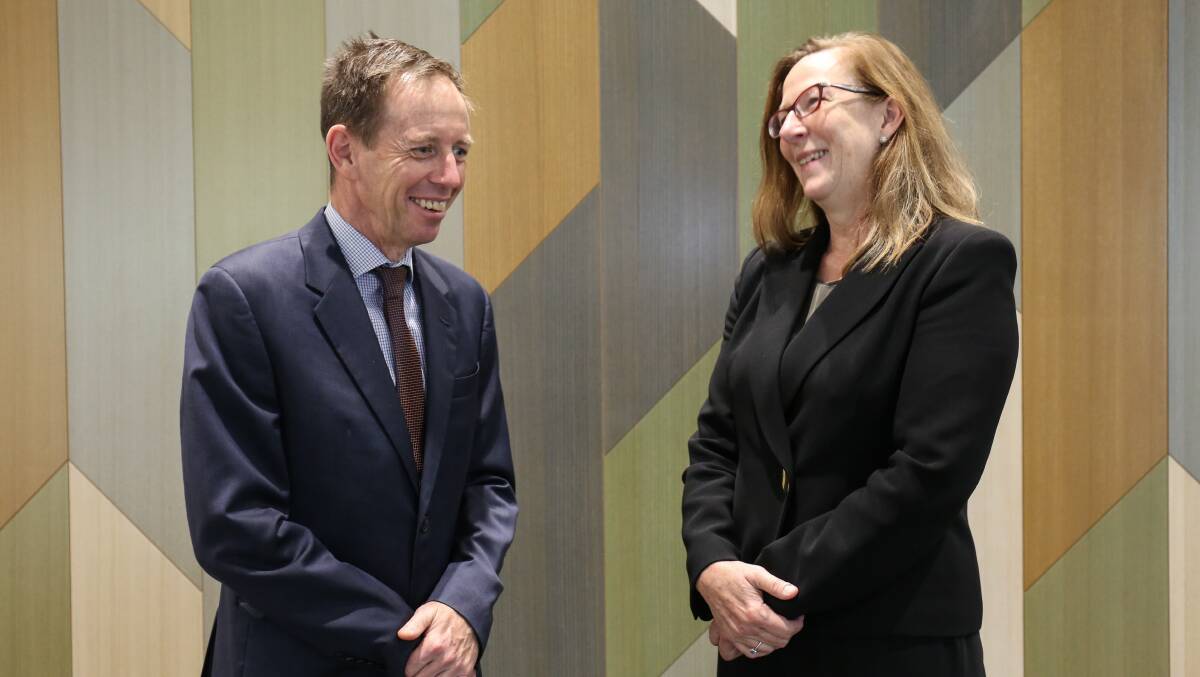 Chief Justice Lucy McCallum, right, speaks to ACT Attorney-General Shane Rattenbury after being sworn in on Tuesday. Picture: James Croucher