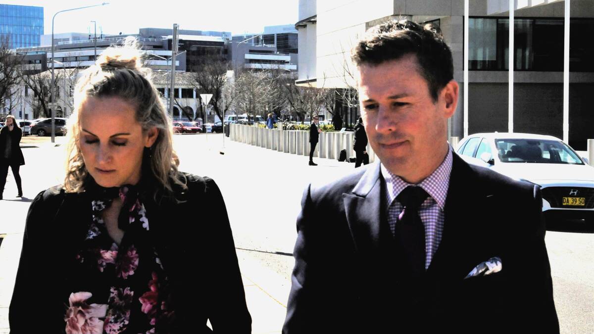Lawyer Ben Aulich, right, leaves court with partner Erin Taylor on Friday. Picture: Blake Foden
