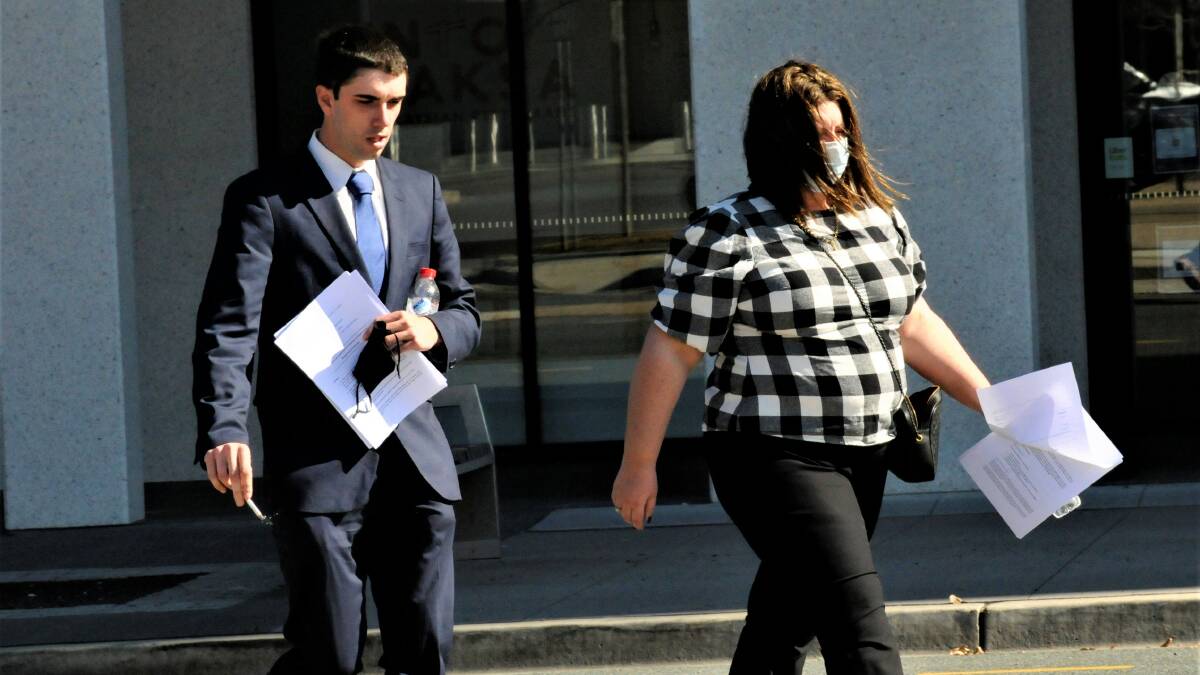 Darcy Page, left, walks through Civic after a sentence hearing last week. Picture: Blake Foden
