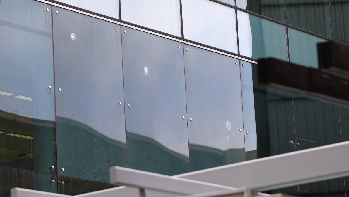 Bullet holes in the windows at Canberra Airport after the August incident. Picture: Keegan Carroll