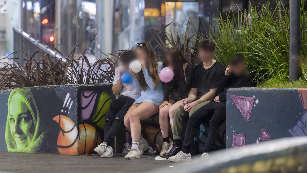 Young partygoers use "nangs" during a night out in Civic. Picture: Keegan Carroll