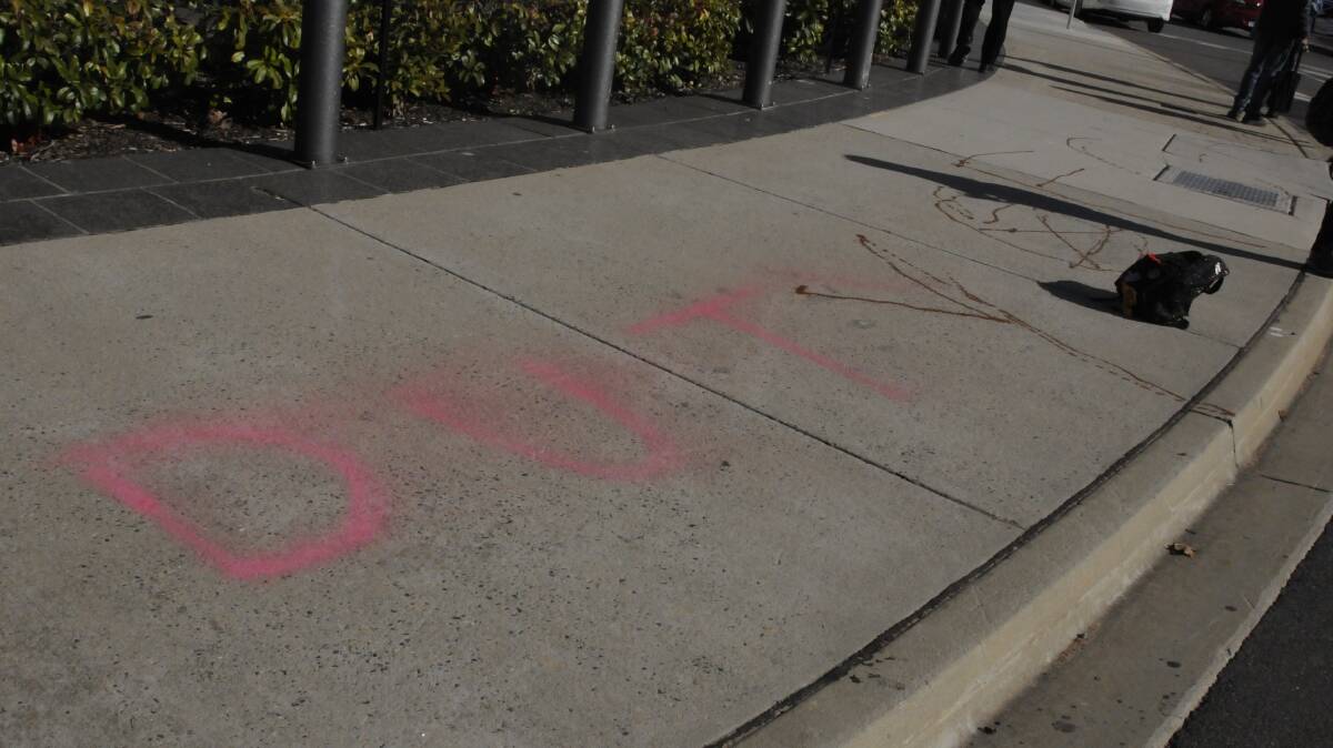 Graffiti on the pavement outside the ACT courts. Picture: Blake Foden