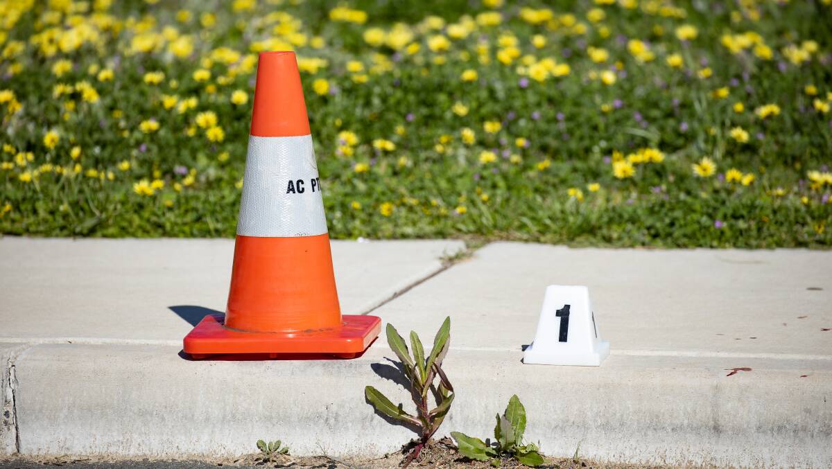 A police evidence marker at the scene, in Weston Creek, after the fatal fight. Picture: Sitthixay Ditthavong