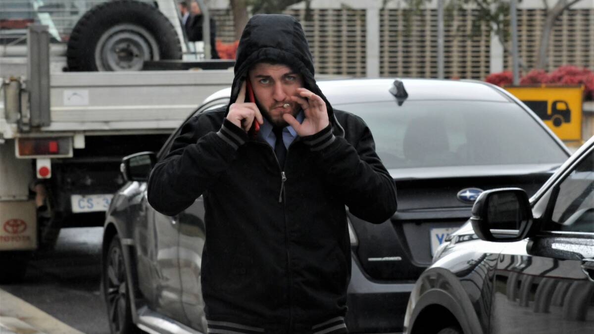 Jordan Knight smokes a cigarette outside court on Tuesday. Picture: Blake Foden